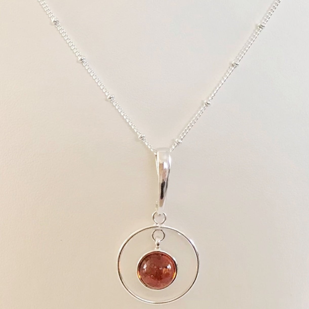 Sterling Silver Circular Amber Pendant Necklace